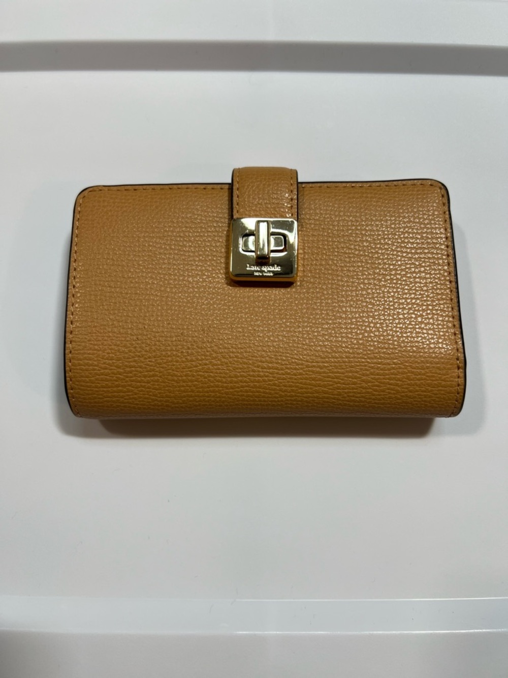 kate spade Tan Leather bifold Wallet with Gold Turn-Lock
